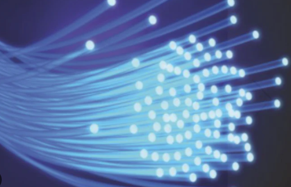 Bundle of end-glow PMMA fibres lit with a blue LED, showing bright points at each cut end